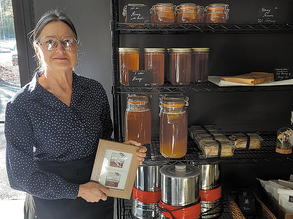 Longtime chocolate and honey shop crosses the river